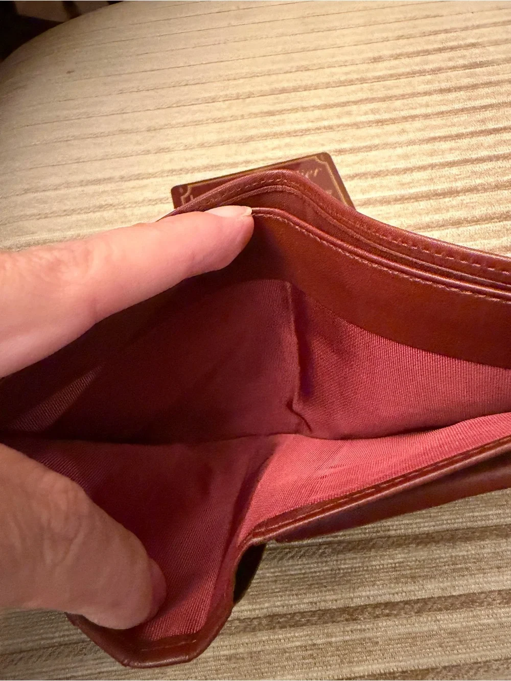 Cartier Burgundy Leather Bifold Wallet with Gold Corner Accents